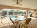 Inviting outdoor living space with patio furniture and scenic pool views at 26137 Dunedin Ct, Punta Gorda, FL 33983
