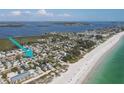 Expansive view of the beach homes near the ocean with white sand at 3007 Avenue E # A, Holmes Beach, FL 34217