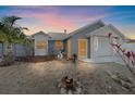 Charming home featuring a well-maintained yard, a mix of textures and neutral paint at 5002 Bunyan St, Sarasota, FL 34232