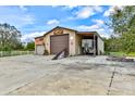 Large detached garage with multiple bays, custom paint, and room for projects and storage at 15890 County Road 675, Parrish, FL 34219