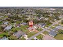 Aerial view of a residential neighborhood with lush greenery and well-maintained homes at 215 Santarem Cir, Punta Gorda, FL 33983