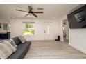 Bright living room with stylish gray floors and comfortable seating area at 4210 Pandora Rd, Venice, FL 34293