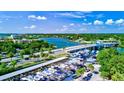 Panoramic aerial view showcasing the coastal waterway, bridge, and nearby boat storage facility at 4710 Gleason Ave, Sarasota, FL 34242