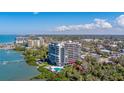 Stunning waterfront condo building featuring a pool and beautiful landscaping, located on serene waters at 500 N Osceola Ave # 203, Clearwater, FL 33755