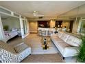 Bright living area includes a comfortable seating area, bar seating, and views into the bedroom at 500 N Osceola Ave # 203, Clearwater, FL 33755