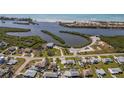 Stunning aerial view of coastal neighborhood and beach at 1565 Saturn Rd, Venice, FL 34293