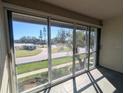 Enclosed lanai featuring tiled flooring and sliding glass doors with views of the community at 1613 Southwood St # 1613, Sarasota, FL 34231