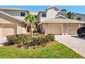 Inviting two-story townhome with a two-car garage and well manicured landscaping at 1718 Starling Dr # 104, Sarasota, FL 34231