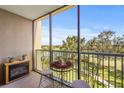 Relaxing screened balcony with outdoor furniture and views of the surrounding golf course at 2320 Terra Ceia Bay Blvd # 406, Palmetto, FL 34221