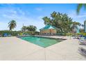 Enjoy the community pool surrounded by lush landscaping and featuring a covered seating area at 2320 Terra Ceia Bay Blvd # 406, Palmetto, FL 34221