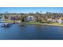 Stunning waterfront home surrounded by lush landscaping, private boat dock, and beautiful water views at 2828 Riverview Blvd, Bradenton, FL 34205