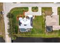 Aerial view of the property showing the house, yard, pool, and proximity to the water at 292 Long Meadow Ln, Rotonda West, FL 33947