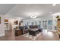 Spacious living room featuring modern recessed lighting, neutral colors, and access to the lanai at 3330 Thornwood Rd # 3330, Sarasota, FL 34231