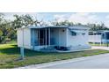 Charming single-story home with a well-maintained front yard and covered entry at 415 Oakwood E Blvd, Sarasota, FL 34237