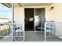 Inviting porch with comfortable seating and a view into the home at 415 Oakwood E Blvd, Sarasota, FL 34237