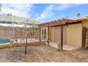 Exterior view of the patio area and screened-in lanai with pool access at 5073 Higel Ave, Sarasota, FL 34242