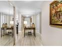 Hallway featuring mirrors on one wall and light-colored flooring at 5970 Midnight Pass Rd # 177, Sarasota, FL 34242