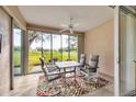 Enclosed patio featuring a dining table set and scenic golf course views at 6314 Stone River Rd # 6314, Bradenton, FL 34203