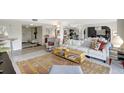 Open-concept living room with comfortable seating, stylish decor, and ample natural light at 6415 Midnight Pass Rd # 211, Sarasota, FL 34242
