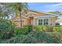 Lovely single-story home with a bay window, manicured bushes, and a well-maintained front yard at 7312 Eleanor Cir, Sarasota, FL 34243