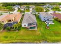 Backyard of property with a screened-in pool, a playground, and lush green grass, perfect for outdoor activities at 12211 Lavender Loop, Bradenton, FL 34212
