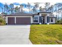 Charming single Gathering home with a three-car garage and a spacious driveway at 12495 Patsy Ave, Port Charlotte, FL 33981