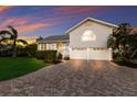 Charming two-story home with grey siding, metal roof, and a welcoming yellow front door at 1528 43Rd Avenue W Dr, Palmetto, FL 34221