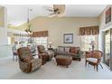 Inviting living room with vaulted ceilings, ceiling fan, comfortable seating, and natural light, perfect for relaxation at 306 Lynbrook Cir # 201, Venice, FL 34292