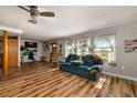 Open concept living room with luxury vinyl plank flooring and abundant light at 34200 State Road 62, Parrish, FL 34219