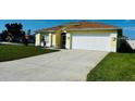 Bright and sunny home with a long driveway and well-manicured front yard at 4515 50Th W Dr, Bradenton, FL 34210