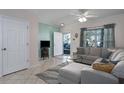 Inviting living room features tile flooring, neutral paint, and a comfortable sectional sofa at 4658 Sabal Key Dr, Bradenton, FL 34203