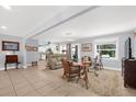 Cozy living room with neutral walls, tile flooring, and comfortable seating arrangement at 503 Park Dr, Bradenton, FL 34209