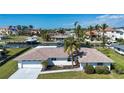 Waterfront home featuring a well-kept lawn, boat dock, and canal access in a desirable neighborhood at 1541 Shelburne Ln, Sarasota, FL 34231