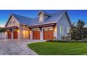 Attached three-car garage with paneled doors and decorative pergola at 1543 Eastbrook Dr, Sarasota, FL 34231