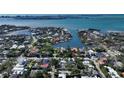 Stunning aerial view of waterfront property in a lush neighborhood with beautiful canal access at 1631 Loma Linda St, Sarasota, FL 34239