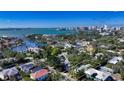 Stunning aerial view of the property showcasing its location and waterfront access with city views at 1631 Loma Linda St, Sarasota, FL 34239