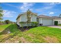 A single-Gathering home displays lush green lawns and well-maintained landscaping at 3631 Pebble Ter, Punta Gorda, FL 33980