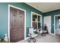 View of screened lanai with seating, decor, ceiling, window, and door at 4802 51 W St # 1017, Bradenton, FL 34210