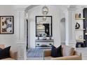 Elegant foyer with a black framed mirror, decor, patterned rug, and an open view of the home at 7024 Brier Creek Ct, Lakewood Ranch, FL 34202