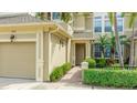 Townhouse exterior featuring a well-manicured landscape and inviting covered entryway at 8043 St Simons St, Bradenton, FL 34201