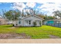 Charming home boasts a spacious front yard and peaceful neighborhood setting at 1004 12Th W Ave, Palmetto, FL 34221