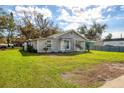 Well-maintained home with a spacious front yard and inviting curb appeal at 1004 12Th W Ave, Palmetto, FL 34221