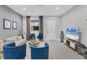 Comfortable living room featuring neutral walls, recessed lights, and modern decor at 1313 Kacerik St, North Port, FL 34288