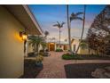 Charming home featuring lush landscaping, a brick walkway, and a welcoming entryway at 204 N Washington Dr, Sarasota, FL 34236