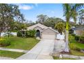 Charming single-Gathering home with well-manicured lawn, mature trees, and beautiful landscaping at 3007 Goodwater St, Sarasota, FL 34231