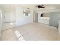 Inviting living room featuring tile floors, natural light, and seamless transition to other spaces at 3035 Pershing Ave, Sarasota, FL 34234