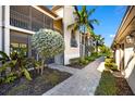 Well-manicured lawn, large balcony, and neutral color scheme create a tranquil outdoor space at 5537 Palmer Cir # 205, Lakewood Ranch, FL 34211