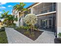 Screened in balcony, and lush landscaping surrounding this well-maintained home at 5537 Palmer Cir # 205, Lakewood Ranch, FL 34211
