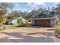 Charming home with a two-car garage and a wide brick driveway at 604 68Th Avenue W Dr, Bradenton, FL 34207