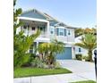 Beautiful two-story home with balcony and neat landscaping at 919 W Warren Ave, Tampa, FL 33602
